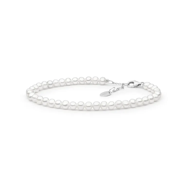 Elegant white pearl bracelet with a silver clasp and adjustable chain, showcasing a classic and timeless design.